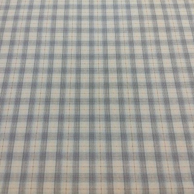 tecido padrão xadrez azul e bege sobre fundo branco