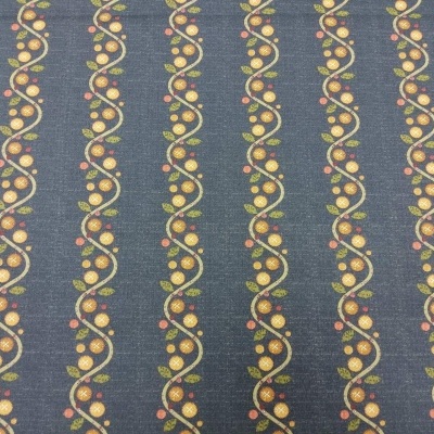 Tecido azul com padrão ondulado de bolas coloridas.