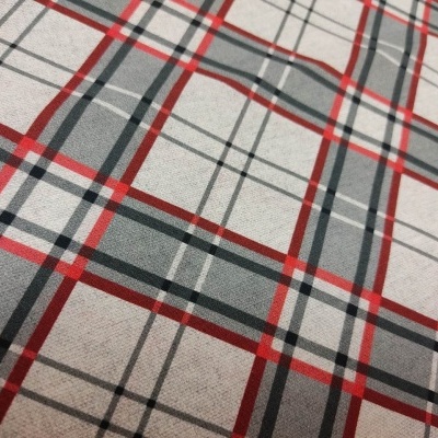 Tecido xadrez com linhas vermelhas, cinzas, pretas e brancas sobre fundo bege