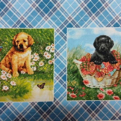 Tecido com estampas de filhotes de cachorro sobre padrão xadrez azul