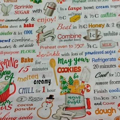 Tecido estampado com receitas e motivos natalícios coloridos