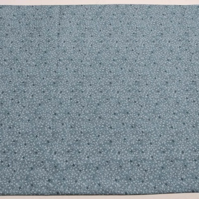 Tecido cinzento com pequenas estrelas e pontos pretos