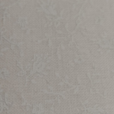 Tecido bege claro com padrão floral em relevo