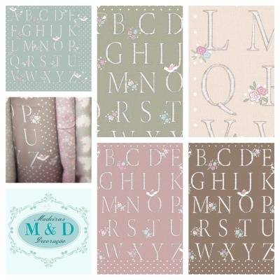tecidos com letras do alfabeto e decoração floral em tons pastel e logo da marca