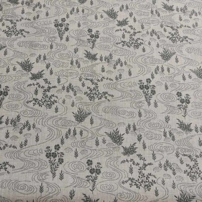 Tecido bege com padrão de folhas cinzentas e pretas