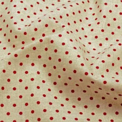 tecido bege com bolinhas vermelhas