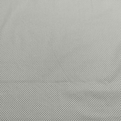 Tecido branco com pontos pretos pequenos e uniformes