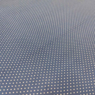 tecido azul com pequenos pontos brancos