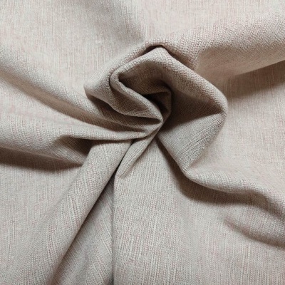 Tecido bege claro com textura riscada em pano franzido