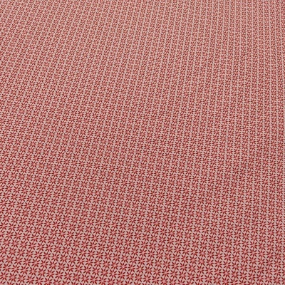 Tecido com padrão vermelho e branco, textura visível, superfície plana.