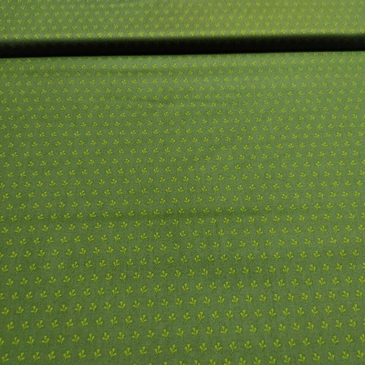 tecido verde com padrão amarelo