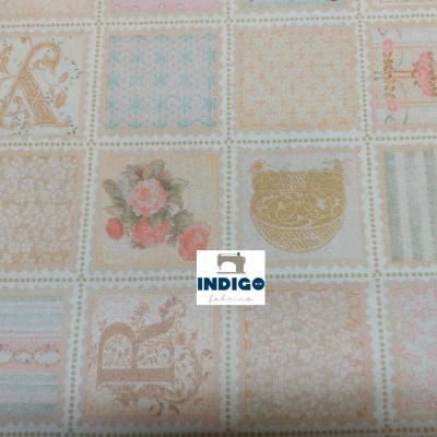 Pano de algodão estampado com quadrados decorativos em tons pastel