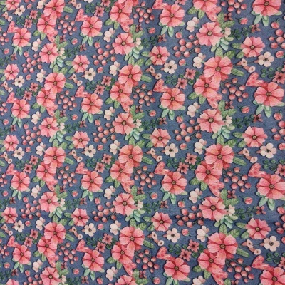Tecido azul com flores cor de rosa e folhas verdes em padrão floral