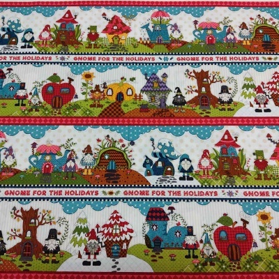 Tecido com padrão de gnomos e casas coloridas e texto 'GNOME FOR THE HOLIDAYS'