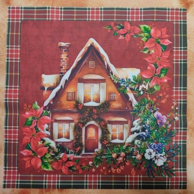 Guardanapo natalício com casa de chalé coberta de neve e flores coloridas com moldura xadrez