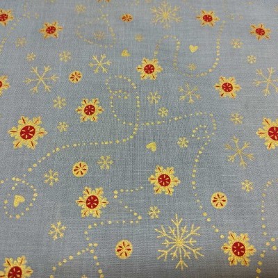 tecido com padrão de flocos de neve e flores em amarelo e vermelho sobre fundo cinzento