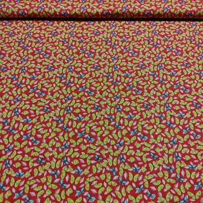 Tecido vermelho com padrão floral amarelo e azul