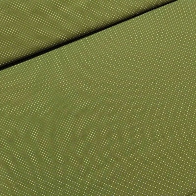 Tecido verde com pequenos pontos brancos