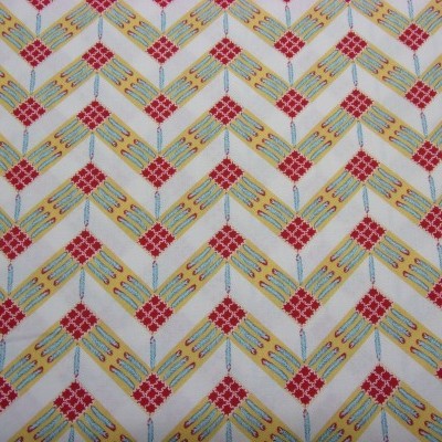 Tecido com padrão geométrico de losangos em amarelo e vermelho sobre fundo branco