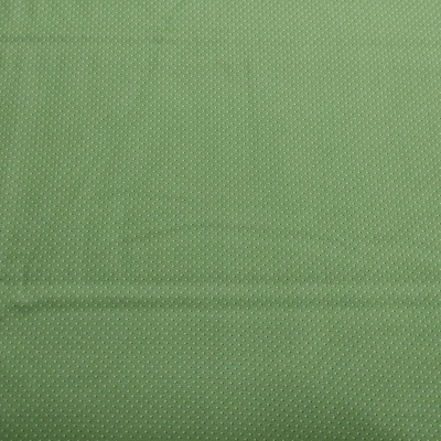 Tecido verde com padrão de pequenos pontos salpicados