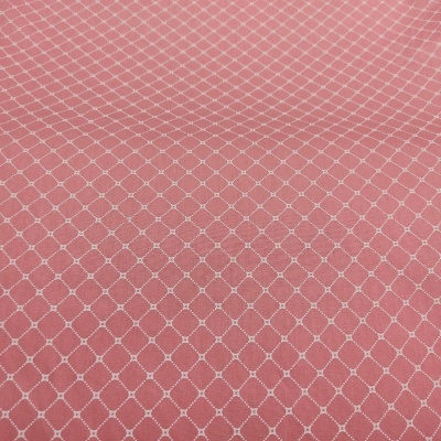 tecido cor-de-rosa com padrão geométrico branco
