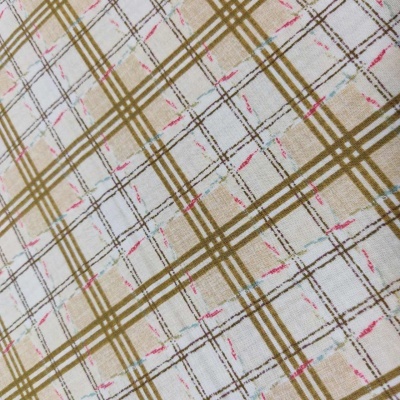 Tecido xadrez com linhas castanhas, bege, azul claro e rosa