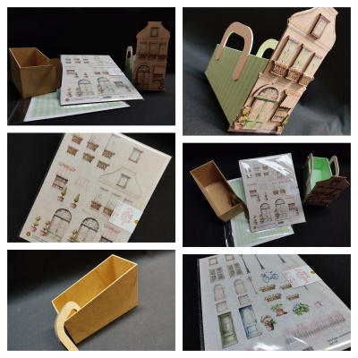 Caixa de cartão castanho com desenhos de fachadas de casas e papéis impressos com elementos decorativos