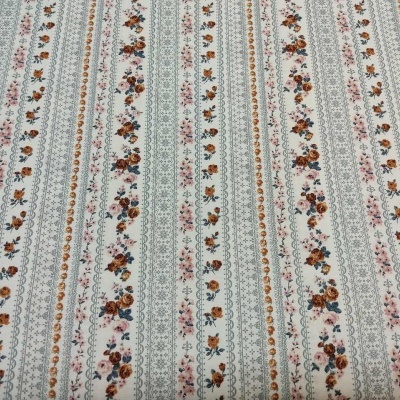 Tecido listrado com padrões florais em várias cores