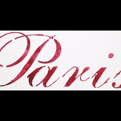 Palavra Paris em letra cursiva vermelha sobre fundo branco