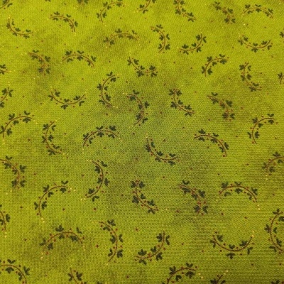 Tecido verde com padrão floral castanho e preto