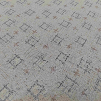 Tecido com padrão geométrico de quadrados cinza e estrelas cor de ferrugem em fundo bege
