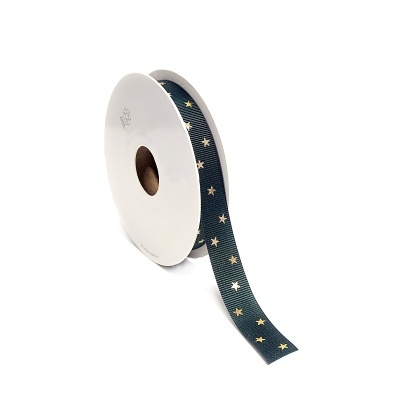 Rolo de fita azul escuro com estrelas douradas em suporte branco