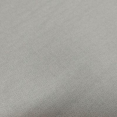 tecido cinzento claro com padrão de pequenos pontos