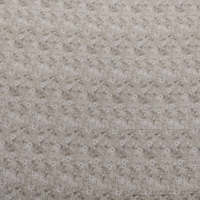 Tecido bege com padrão em relevo sobre madeira clara