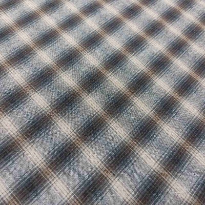 Tecido xadrez azul, cinzento e bege com textura entrelaçada