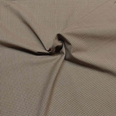 Tecido pied-de-poule castanho e bege com dobras circulares