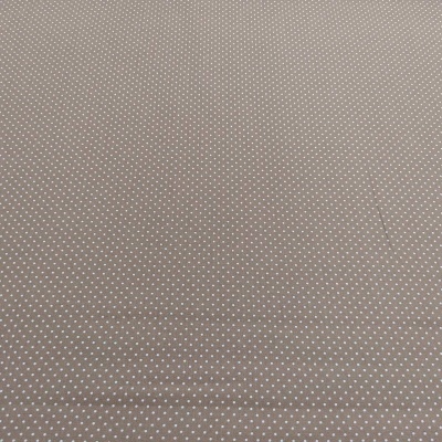 Tecido castanho claro com pequenas bolinhas brancas