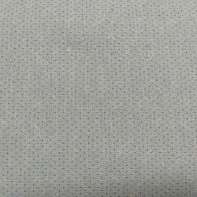 Tecido branco com pequenos pontos azuis