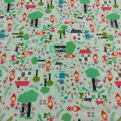 Tecido colorido com padrão de floresta e casas