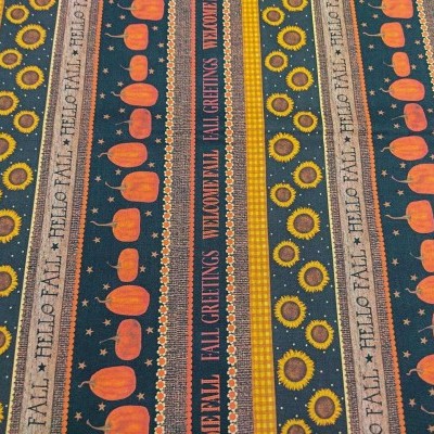 Pano com padrão outonal mostrando abóboras, girassóis, estrelas e texto 