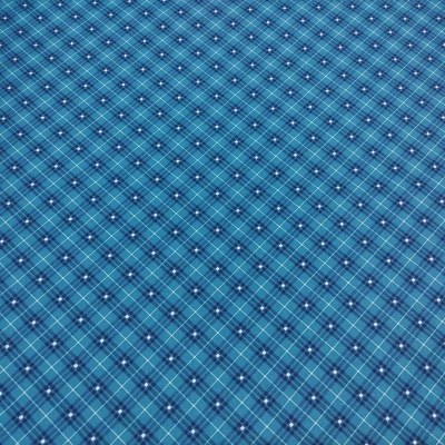 Tecido azul com padrão xadrez e pequenos pontos brancos