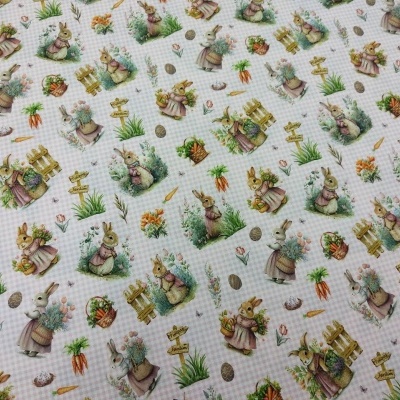 Tecido com padrão de coelhos em várias poses em tons pastel