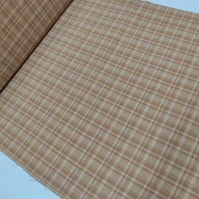 tecido xadrez bege e castanho em tecido plano