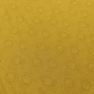 tecido amarelo com padrão de círculos