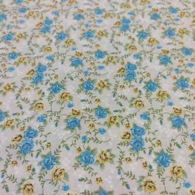 Tecido estampado com flores azuis e amarelas em fundo bege