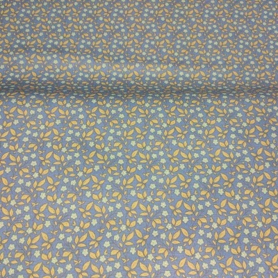 Tecido azul-claro com padrão de folhas amarelas e azuis