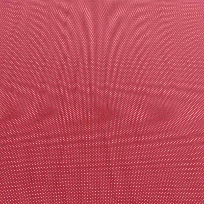 Tecido vermelho com pontos brancos pequenos