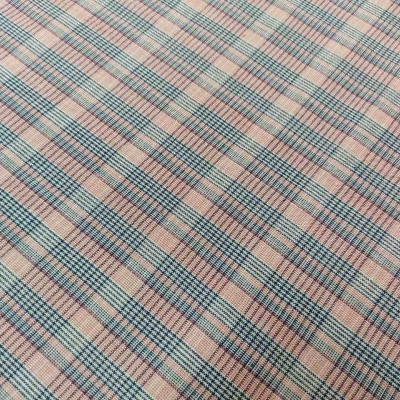 Tecido xadrez azul, rosa e bege com padrão repetitivo