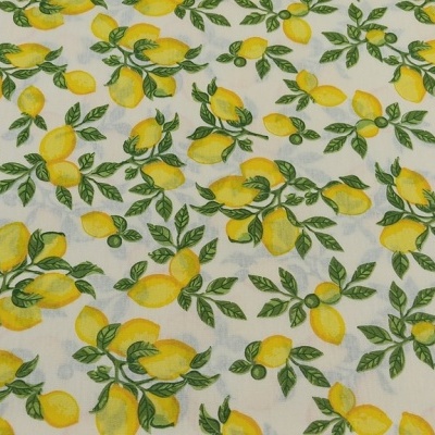 tecido estampado com limões amarelos e folhas verdes sobre fundo branco