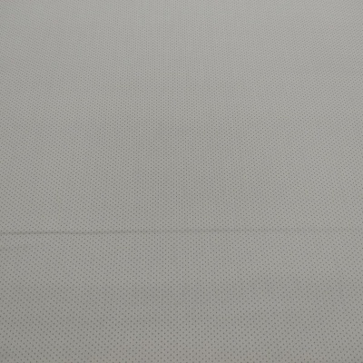 Tecido cinzento claro com padrão de pontos pretos